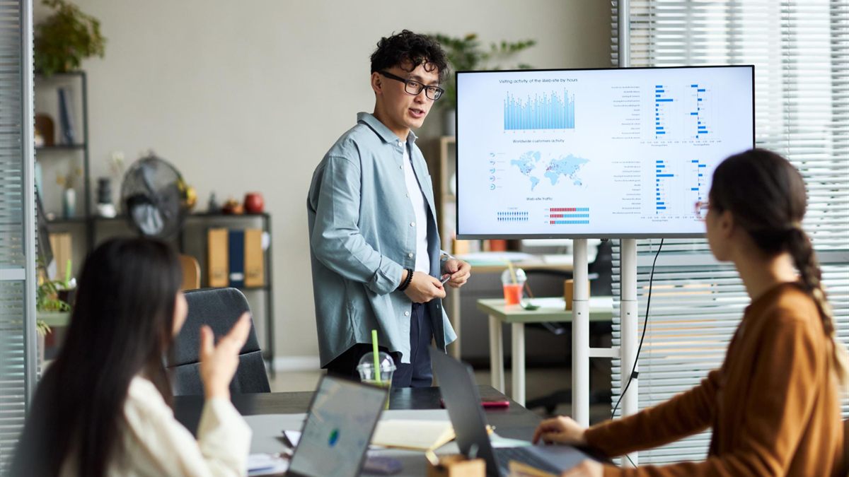 SEO specialists presenting website performance analysis to a business team